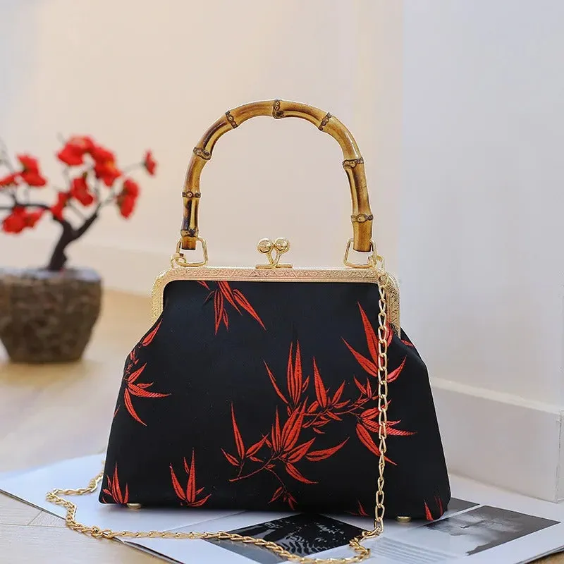 Black BAMBOO HANDLE HANDBAG with Red leaf accent